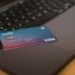 blue and white visa card on silver laptop computer