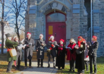 A group of carolers outside of church