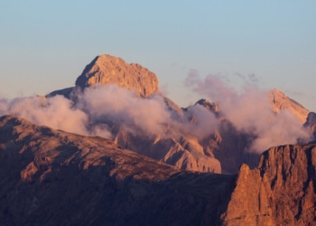 Jagged mountain peaks bathed in golden hour light