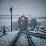 train on rail tracks during daytime