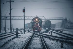 train on rail tracks during daytime