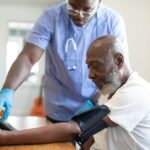 a doctor checking a patient's blood pressure