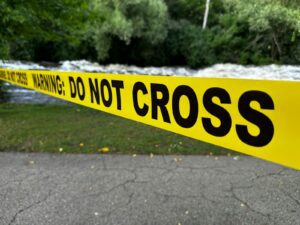 Yellow caution tape with "do not cross" text