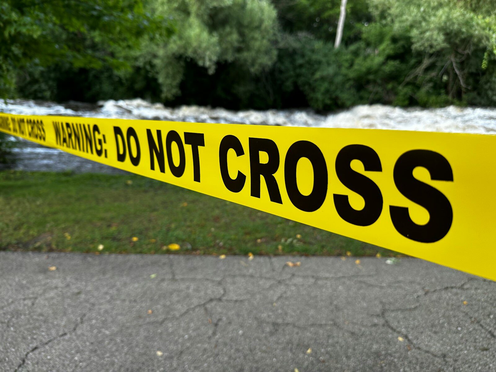 Yellow caution tape with "do not cross" text