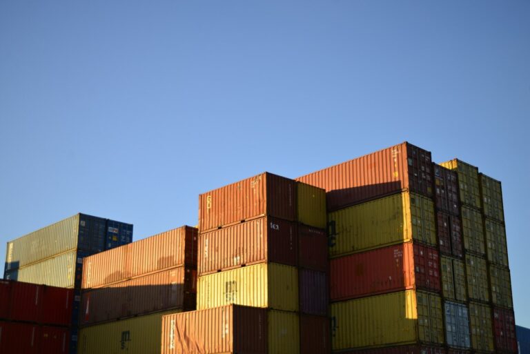 A large stack of containers sitting on top of each other