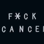 Motivational anti-cancer message on a letter board, emphasizing awareness.