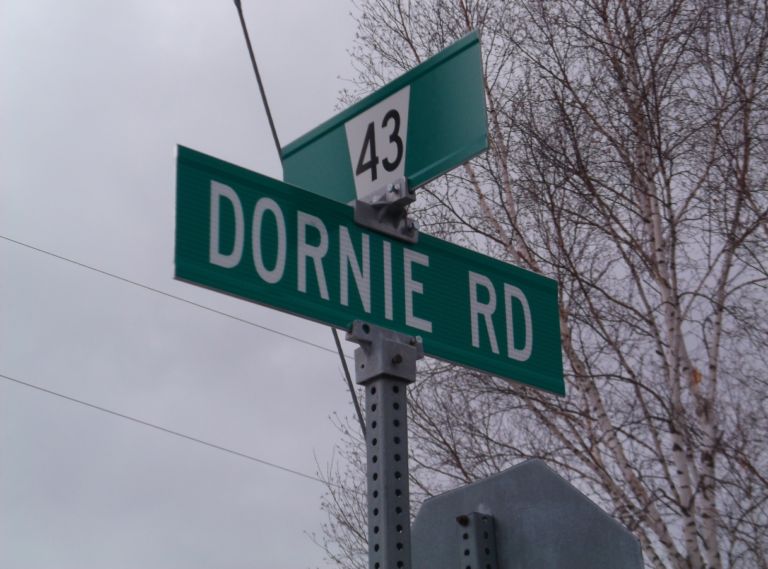 ornie’s   road sign.  You can find Dornie by turning north at Dornie Road off of County Road 43, or by going north from Alexandria on 34, and turning west, on Concession Road 4, and then crossing the railway tracks to the CPR overpass,  and the historic plaque.