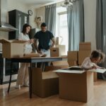 A family unpacking moving boxes during a relocation to Canada