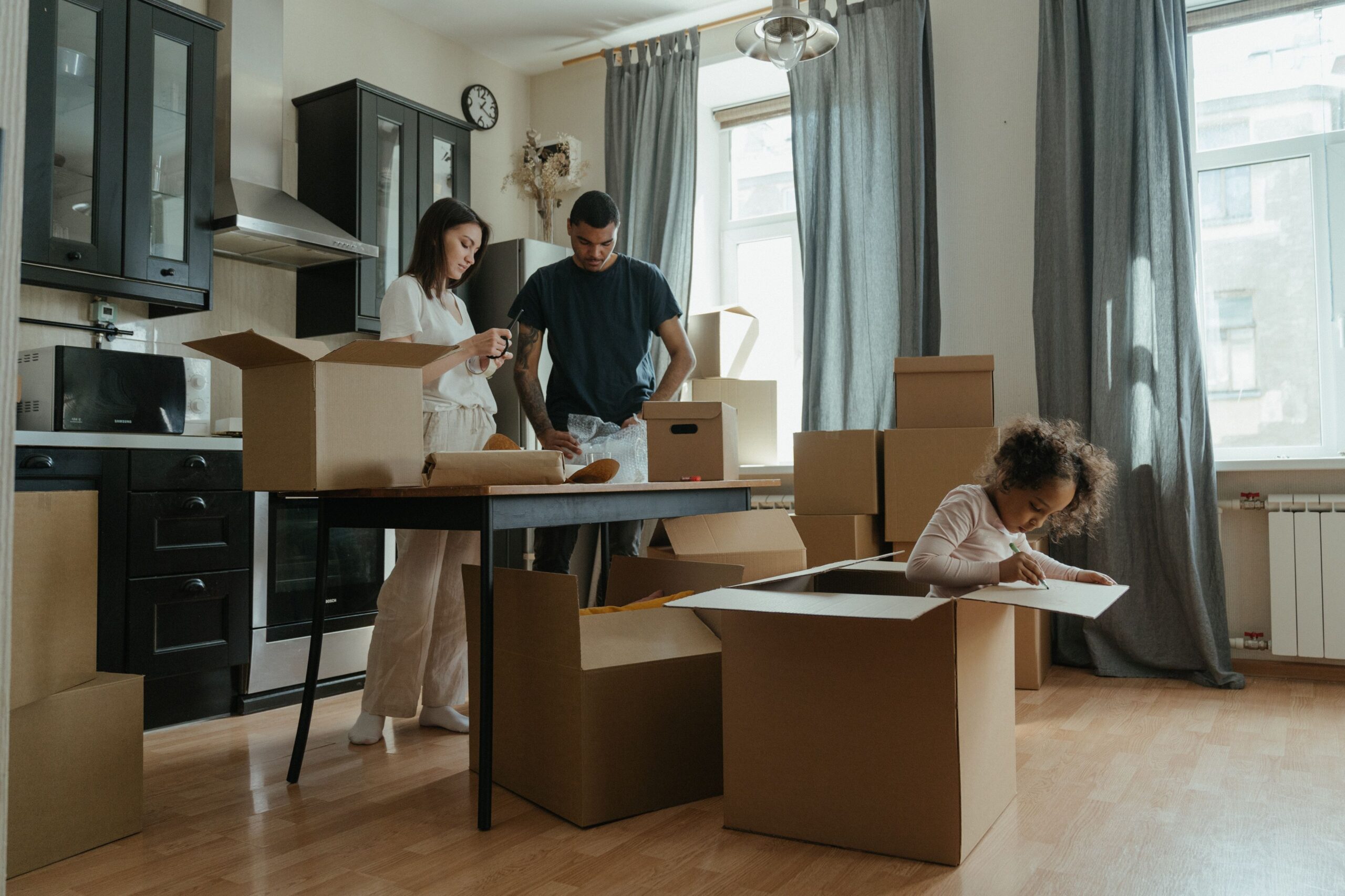 A family unpacking moving boxes during a relocation to Canada