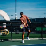 A man on a tennis court holding a tennis racket