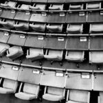 brown wooden chairs on gray concrete floor