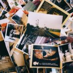 a pile of old photos and postcards sitting on top of each other