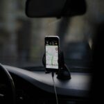 black iphone 4 on car seat