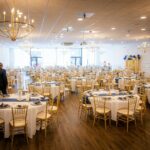 Elegant banquet hall set for an event with round tables