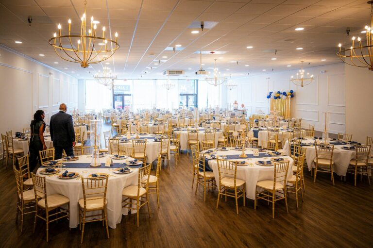 Elegant banquet hall set for an event with round tables