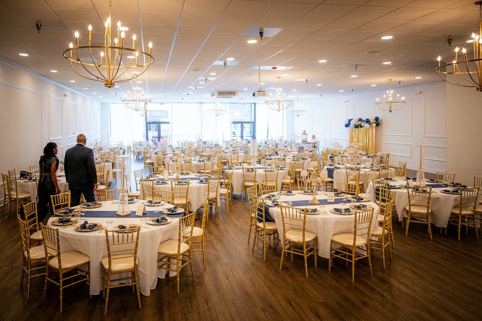 Elegant banquet hall set for an event with round tables