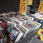 Rows of cds and dvds displayed in a store