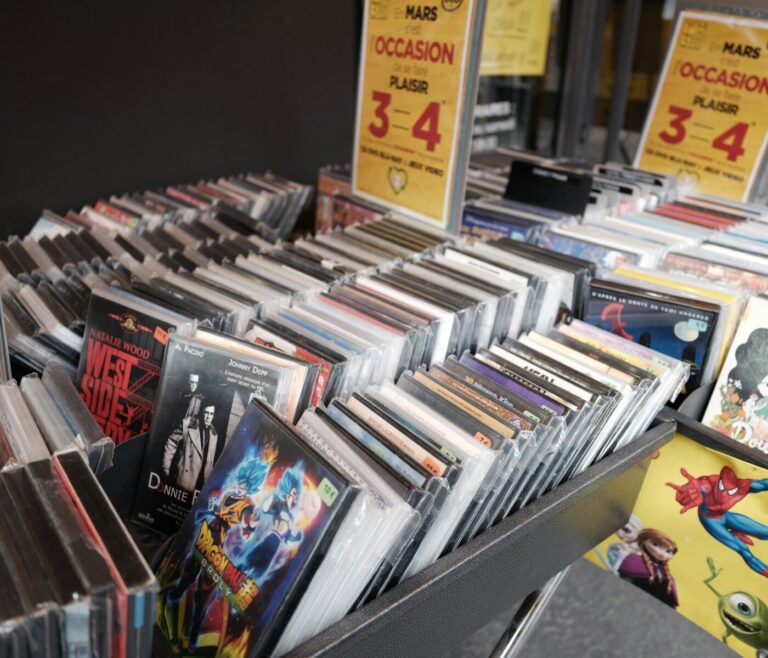 Rows of cds and dvds displayed in a store