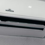 White air conditioner unit displaying 22 degrees
