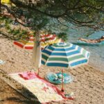 A beach with a lot of umbrellas on it