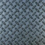 a close up of a metal diamond plate