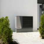 a air conditioner sitting on the side of a building