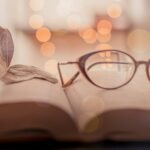 brown framed eyeglasses on book page